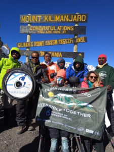 Victory for FAISR at the top of Mount Kilimanjaro. (PHOTO CREDIT James Lassner)