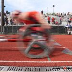 Crossing the finish during the track events at the 2019 Adaptive Sports USA Junior Nationals in Minn. (Photo by Christopher Di Virgilio).