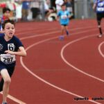 Racing hard at the 2019 Adaptive Sports USA Junior Nationals in Minn. (Photo by Christopher Di Virgilio).