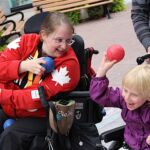 Paralympian Alison Levine (left) shares her passion with Abby (right), a little girl with CP at the Boccia day in Canada