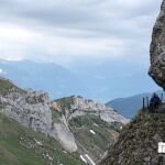 Brett pushes along a little pathway at 7,000-feet on Mt. Pilatus looking down at Switzerland.
