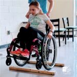 Brooke works her wheelchair skills and is Wheels UP.