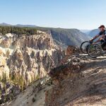 David looks over the edge of the Grand Canyon from Yellowstone.
