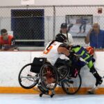A hard check into the boards at the 2019 Wheelchair Lacrosse USA Tournament in Long Island, NY. (Photo by Christopher Di Virgilio/SNS).