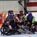 A group of players battle for control of a loose ball at the 2019 Wheelchair Lacrosse USA Tournament in Long Island, NY. (Photo by Christopher Di Virgilio/SNS).