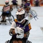 A wheelchair lacrosse player manuvers with the ball at the 2019 Wheelchair Lacrosse USA Tournament in Long Island, NY. (Photo by Christopher Di Virgilio/SNS).