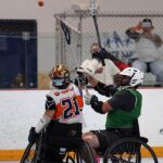 A player puts the ball over the head of his opponent at the 2019 Wheelchair Lacrosse USA Tournament in Long Island, NY. (Photo by Christopher Di Virgilio/SNS).