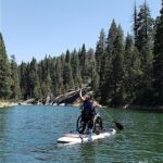 Mia gives paddle boarding a try on the Shaver Lake in Fresno, Ca.
