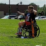 Zachary Carter competes in the archery event at the 2019 Adaptive Sports USA Junior Nationals in Minn.