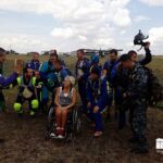 Diana celebrates her successful day of skydiving with friends in the Ukraine.