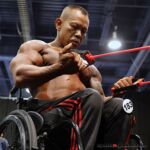 Wheelchair bodybuilder Kris Dim pumps up prior to taking the stage at the 2019 Mr. Olympia in Las Vegas, Nev. (Photo by Christopher DiVirgilio/SNS).