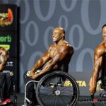 Kris Dim (left) Harold Kelly and Steve Lister (right) pose down at the 2019 Mr. Olympia in Las Vegas, Nev. (Photo by Christopher DiVirgilio/SNS).