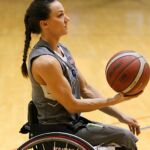 Wolfpack's megan Blunk lines up a shot during a game at the 21st Annual D1 Wheelchair Basketball Tournament in Phoenix, Ariz. (Photo by Christopher Di Virgilio).