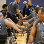 The Wolfpack and Punishers give congratulations after a game at the 21st Annual D1 Wheelchair Basketball Tournament in Phoenix, Ariz. (Photo by Christopher Di Virgilio).