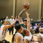 Seattle's joe Chambers towers over his opponents during a game at the 21st Annual D1 Wheelchair Basketball Tournament in Phoenix, Ariz. (Photo by Christopher Di Virgilio).