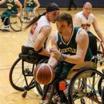 Seattle's Stuart Olsen moves the ball during a game at the 21st Annual D1 Wheelchair Basketball Tournament in Phoenix, Ariz. (Photo by Christopher Di Virgilio).
