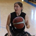 Courtney Ryan of the Lobos moves the ball during the 21st Annual D1 Wheelchair Basketball Tournament in Phoenix, Ariz. (Photo by Christopher Di Virgilio).
