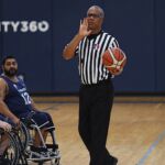 An official works out a play at the 21st Annual D1 Wheelchair Basketball Tournament in Phoenix, Ariz. (Photo by Christopher Di Virgilio).