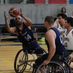 Avery Moore, #14, keeps the ball in play during the 21st Annual D1 Wheelchair Basketball Tournament in Phoenix, Ariz. (Photo by Christopher Di Virgilio).