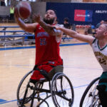 Seattle Sonics, Jose Cabrera, #22, tries to defend NMCSD Wolfpack's Jorge Salazar, #25, during the 21st Annual D-1 Wheelchair Basketball Tournament. (Photo By Josh Eisenberg).