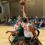 Reaching for the ball at the 21st Annual D1 Wheelchair Basketball Tournament in Phoenix, Ariz. (Photo by Christopher Di Virgilio).