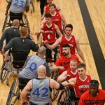 Dallas and Toronto give the "high elbows" when handshakes and high-fives were forbidden during the start of the COVID-19 outbreak at the 2020 Toyota national Wheelchair Basketball Tournament in Wichita, Kan. (Photo by Christopher Di Virgilio).
