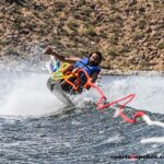 Obanel Serrano crests the wakes of Bartlett Lake during the 2020 Arizona Adaptive Water Sports Day on the Lake in Carefree, Ariz. (Photo by Christopher Di Virgilio). water_skiing01
