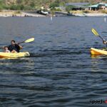 Two adaptive kayakers paddle by during the 2020 Arizona Adaptive Water Sports Day on the Lake in Carefree, Ariz. (Photo by Christopher Di Virgilio). kayaking02