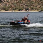 The Minihan family go by while enjoying a day of tubing at Bartlett Lake in Carefree, Ariz., during the 2020 Arizona Adaptive Watersports Day on the Lake. (Photo by Christopher Di Virgilio). tubing_02