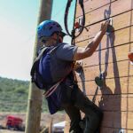 Josue Acaron makes his way up the rock wall during the Climbing Challenge at the 2021 Submerged Festival in Park City, Utah. (Photo by Christopher Di Virgilio).