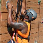 Aaron Murray attempts the rock wall at the climbing challenge course at the National Ability Center in Park City, Utah during the 2021 Submerged Festival. (Photo by Christopher Di Virgilio).