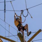 Ryan Helgerson muscles his way across a segment of obstacle at the National Ability Center in Park City, Utah during the 2021 Submerged Festival. (Photo by Christopher Di Virgilio).