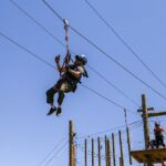 Josue Acaron enjoys the climbing challenge course at the National Ability Center in Park City, Utah during the 2021 Submerged Festival. (Photo by Christopher Di Virgilio).