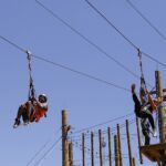 Aaron Murray (left) and Skylar Zamalloa enjoy the climbing challenge course at the National Ability Center in Park City, Utah during the 2021 Submerged Festival. (Photo by Christopher Di Virgilio).