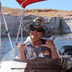 Jo Crawford, gives a double-shaka and big smile as she pilots a pontoon up Lake Powell during an adaptive water event hosted by Arizona Adaptive Watersports. (Photo by Christopher Di Virgilio/SNS).