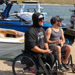 Adaptive wake surfers chat at the Wild West Wake Surf Shootout 2024. (Photo by Brittany Martin).