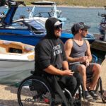 Adaptive wake surfers chat at the Wild West Wake Surf Shootout 2024. (Photo by Brittany Martin).