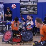 Josh Wheeler, white jersey, passes the ball over Alex Pabon during the 2025 USWRA championshio game. (Photo by Christopher Di Virgilio).