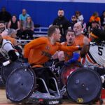 Members of the Texas Stampede surround James Adams, No. 5, during the 2025 USWRA Championships. (Photo by Christopher Di Virgilio).