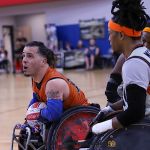 Texas Stampede's Alex Pabon, with ball, voices his concern over a call during the 2025 USWRA Division I championships. (Photo by Christopher Di Virgilio).