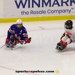 Team USA's Declan Farmer, No 16, attempts to get past Rob Armstrong during the gold medal match at the 2025 World Para Ice Hockey Championships at LECOM Harborcenter in Buffalo. (Photo by Christopher Di Virgilio).