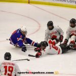 USA's Jack Wallace, No. 8 and Canada's Tyler McGregor, also No. 8, battle for the puck during the gold medal match at the 2025 World Para Ice Hockey Championships at LECOM Harborcenter in Buffalo. (Photo by Christopher Di Virgilio).