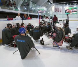 Mexico, Brazil, US and Canadian players in the huddle while playing a game in Santa Fe, Mexico City, Mexico. First-ever Latin America Para Ice Hockey Skills Camp. (Photo by COPAME National Paralympic Committee of Mexico). Latin America Para Ice Hockey Skills Camp.